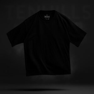 Black oversized t-shirt with a relaxed fit and short sleeves, displayed mid air.